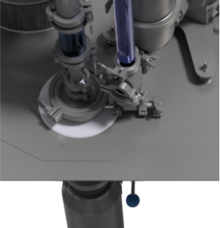 Close-up of an industrial mechanism, displaying interconnected pipes and valves, with a transparent section for observation.